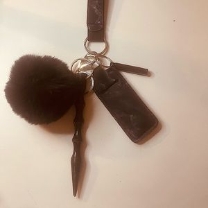 Keychain Includes: window breaker, Pom Pom, chapstick holder, safety whistle